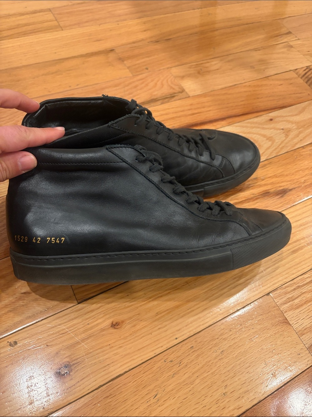 Common Projects Black Leather High-Top Sneakers with Gold Accent
